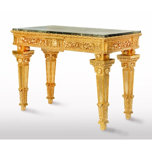 An Italian neoclassical carved and gilded wood console table, with a rectangular Verde Alpi marble top.